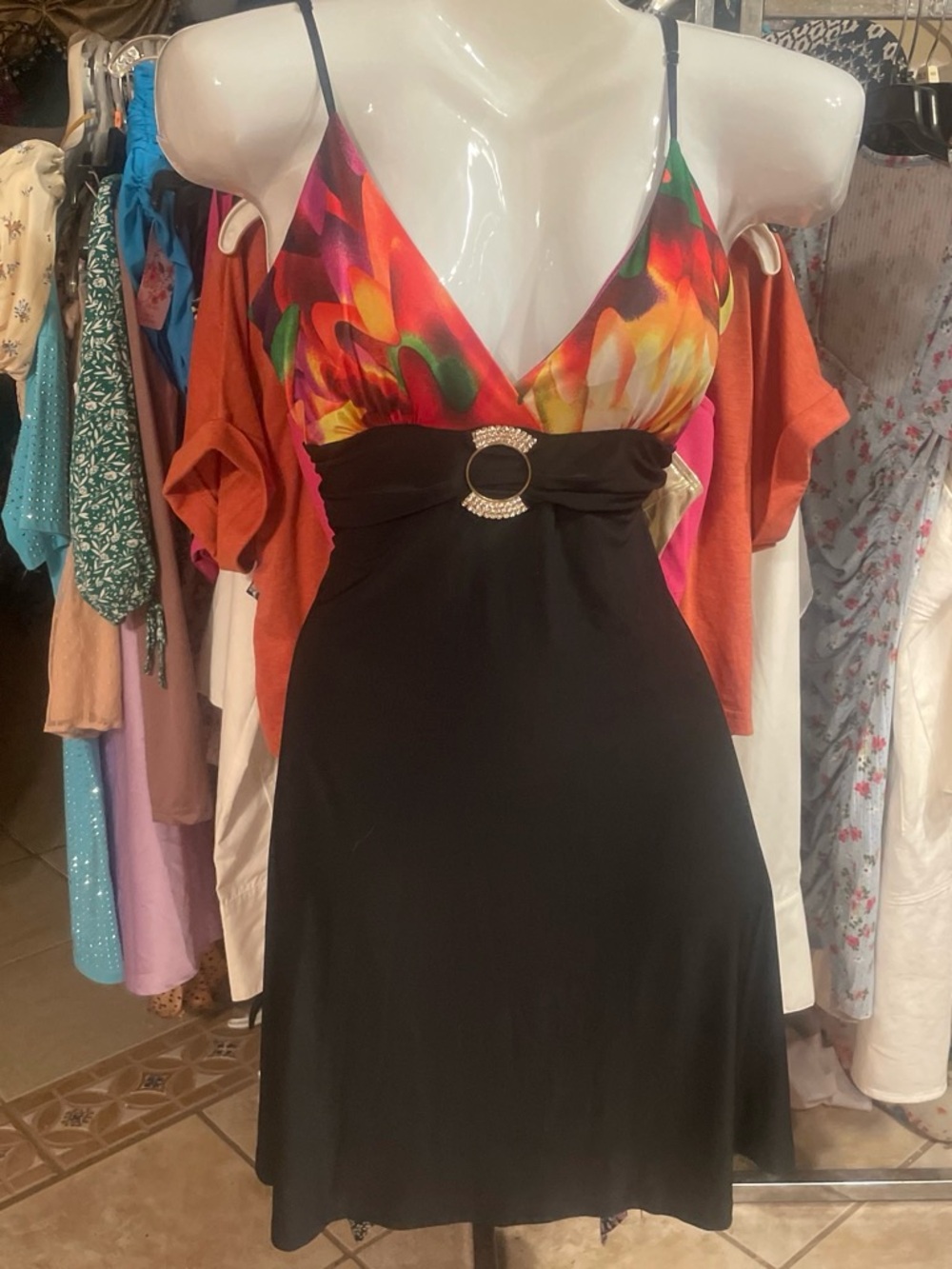 Black Mini Dress with Vibrant Floral Bodice and Ring Accent